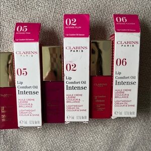 Set of 3 NWT Clarins Lip Comfort Oil Intense - Pink, Plum, Fuchsia available